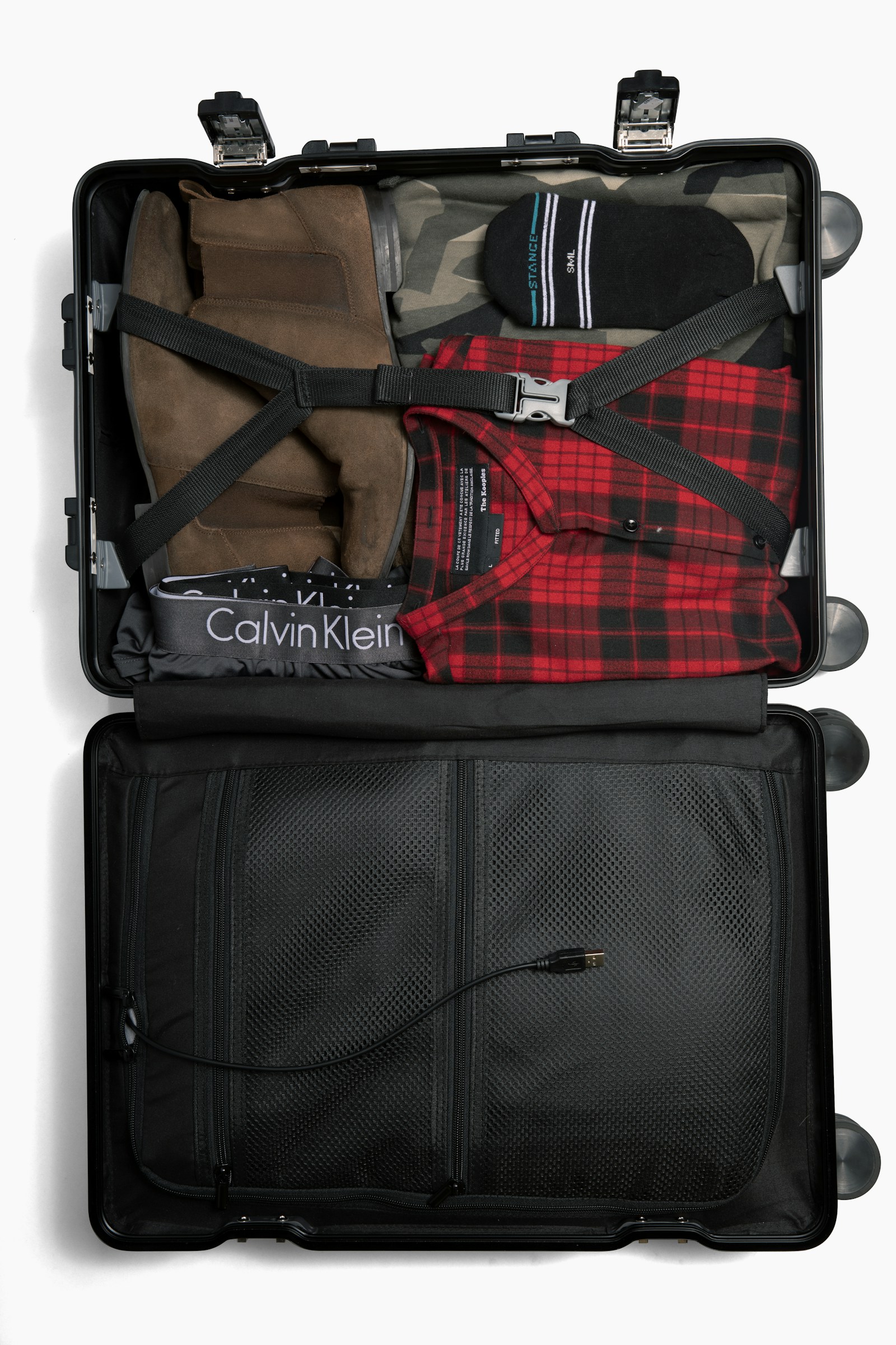 An open suitcase with neatly arranged packing cubes